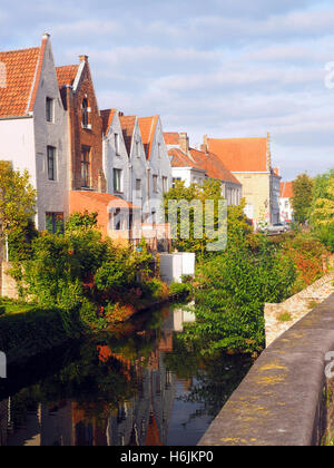 medieval houses along canal tourist destination Bruges Brugge Belgium Europe Stock Photo