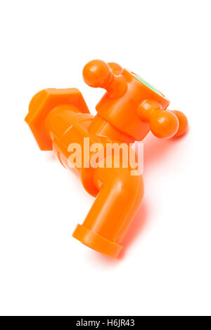 orange plastic faucet on a white background Stock Photo
