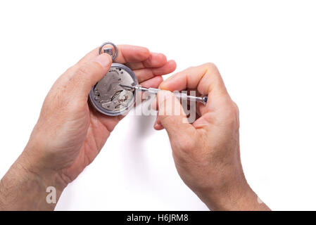 Male hand repairing a watch. isolated on white background Stock Photo