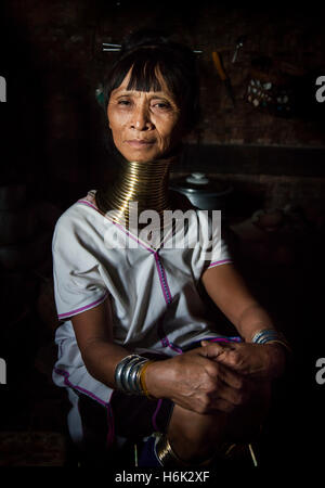 Lake Inle, Myanmar, 17th November, 2014: Kayan tribe woman in her kitchen posing