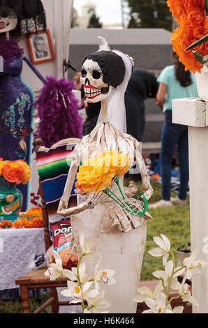 Flower and skeleton dog, cat and bird alter at Dia de los Muertos, Day of the dead, in Los Angeles at the Hollywood Forever Ceme Stock Photo