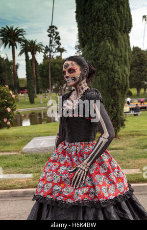 Skeleton woman performer at Dia de los Muertos, Day of the dead, in Los Angeles at the Hollywood Forever Cemetery grounds. Edito Stock Photo
