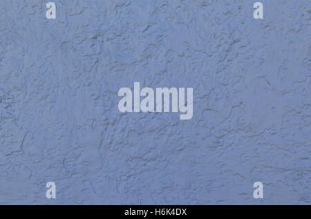 Blue stucco wall forms an irregular pattern that can be used for backgrounds. Stock Photo