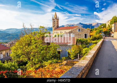Church in Zonza village with typical stone houses during sunset, Corsica, France, Europe. Stock Photo