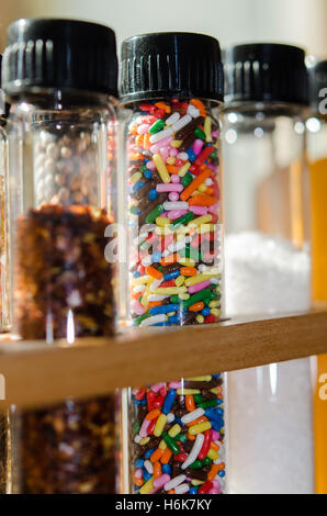 Row of test tubes with spices pepper salt and sprinkles Stock Photo