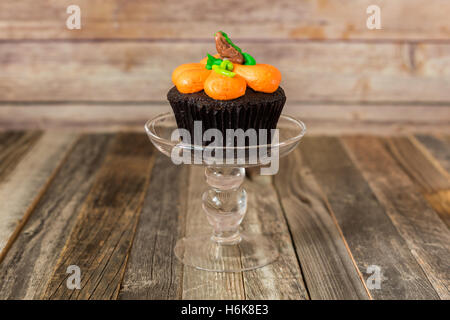 Fall cupcake on a glass stand Stock Photo