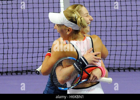 Singapore. 30th Oct, 2016. Ekaterina Makarova (back) and Elena Vesnina of Russia celebrate after winning their WTA Finals match against Bethanie Mattek-Sands of Romania and Lucie Safarova of the Czech Republic at Singapore Indoor Stadium, Oct. 30, 2016. Ekaterina Makarova and Elena Vesnina won 2-0. © Then Chih Wey/Xinhua/Alamy Live News Stock Photo