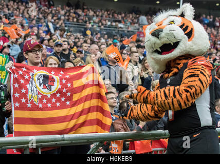 Wembley Stadium, London, UK. 30th Oct, 2016. NFL International Series. Cincinnati Bengals versus Washington Redskins. The Cincinnati mascot 'WHO-DEY' pointing to a Washington Redskins fan in the front row of the stands holding a Redskins flag during the game. © Action Plus Sports/Alamy Live News Stock Photo