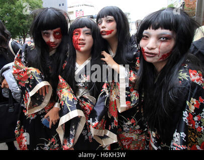 Kawasaki, Japan. 30th Oct, 2016. Participants wearing costumes take part in a Halloween parade on a street in Kawasaki, suburban Tokyo on Sunday, October 30, 2016. 130,000 visitors watched the street costume parade in which some 2,600 people took part. Credit:  Yoshio Tsunoda/AFLO/Alamy Live News Stock Photo