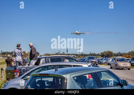 Christchurch, New Zealand. 31 October 2016. Crowds gather on a road outside Christchurch International Airport to watch the arrival of the first Airbus A380 to land there, inaugurating a service by Emirates from Dubai via Sydney. Stock Photo