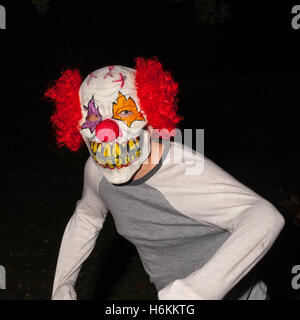 Suffolk,UK,30th October 2016. Teenage boy in Halloween clown mask going out to scare people in this unsavoury new craze sweeping across the country. @Tim Oram/Alamy Live News. Stock Photo