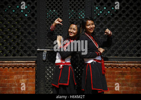 Kathmandu, Nepal. 31st Oct, 2016. Nepalese girls wearing traditional attire from ethnic Newar community pose for their friend while celebrating their New Year in Kathmandu, Nepal on Monday, October 31, 2016. Newari people celebrate their New Year by praying for longevity and performing rituals for purification of one's soul. Credit:  Skanda Gautam/ZUMA Wire/Alamy Live News Stock Photo