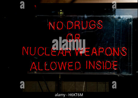 No Drugs or Nuclear Weapons Allowed Inside’ neon sign on Bourbon Street