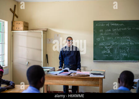 The teacher Tobias Mwaudikange has a lesson of natural science with the 4th grade of visually impaired children at Eluwa Special School in Ongwediva, Namibia. Stock Photo