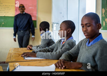 The teacher Tobias Mwaudikange has a lesson of natural science with the 4th grade of visually impaired children at Eluwa Special School in Ongwediva, Namibia. Stock Photo