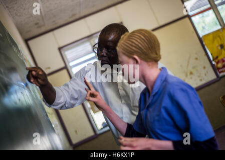 The teacher Richard Tjaronda shows easy way of counting with the number line for his learners during Mathematic lesson at Eluwa Special School in Ongwediva, Namibia. Stock Photo