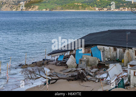 Flood-tide cause the collapse of a bar in the beach of the Salve, zone of the strut in the town of Laredo, Cantabria, Spain, Stock Photo