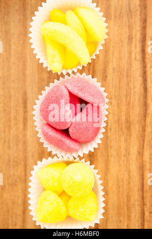 Types of candies placed in small bowls by type and color Stock Photo