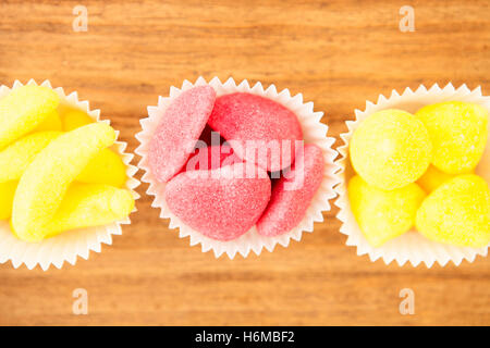 Types of candies placed in small bowls by type and color Stock Photo