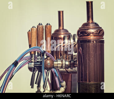 Drought beer taps and other beverages in a bar. Stock Photo