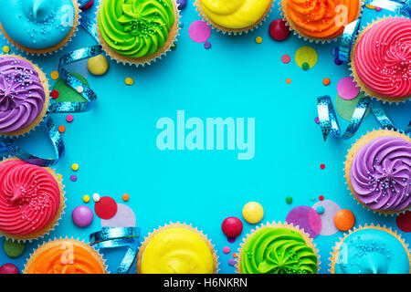 Party background with cupcakes and confetti Stock Photo