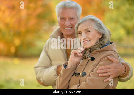Portrait of a beautiful middle-aged couple in the autumn park Stock Photo