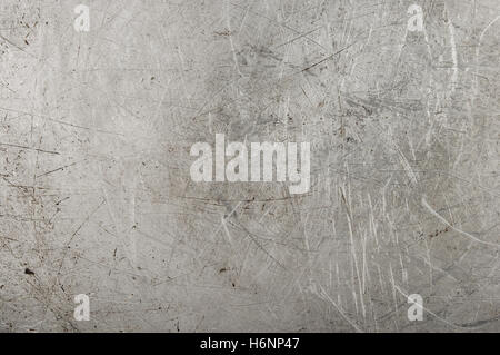 texture of the old aluminum surface with rivets, corrosion, scratches, and dents Stock Photo