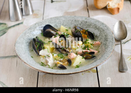 Freshly made creamy fish and mussel soup Stock Photo