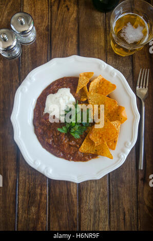 Chilli con carne with tortilla crisps Stock Photo