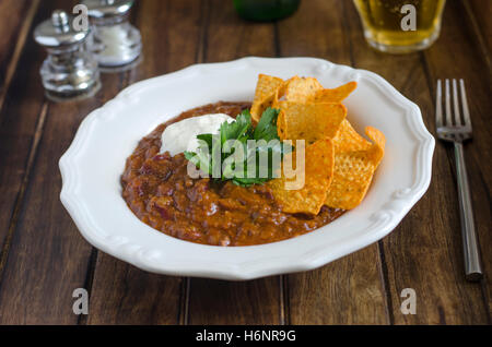 Chilli con carne with tortilla crisps Stock Photo