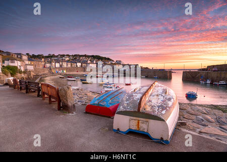 Beuatiful sunrise over the harbour at Mousehole near Penzance on the Cornish coast Stock Photo