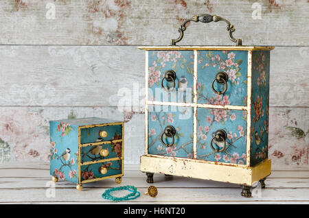 Vintage style jewellery chests decoupaged in blue and gold Stock Photo
