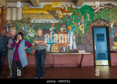 San Francisco, CA, USA, Art, Museum Tourists Visiting, 1930's era Public Wall Mural Paintings, in Coit Tower, 'North Beach', looking at painting, historic holidays Stock Photo