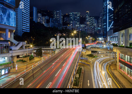 View of light trails on the Cotton Tree Drive road and high-rise apartment buildings in Mid-Levels in Hong Kong, China at night. Stock Photo