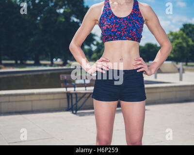 slim athletic woman torso abs belly wearing sportswear close up. slimming  and diet concept. fitness female body torso and booty. Portrait of  beautiful fitness model Stock Photo