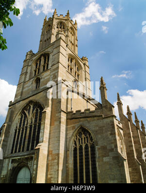 Tower, octagonal lantern & S aisle of Fotheringhay C15th church, Northamptonshire, with a flying buttress & main buttresses topped by pinnacles. Stock Photo