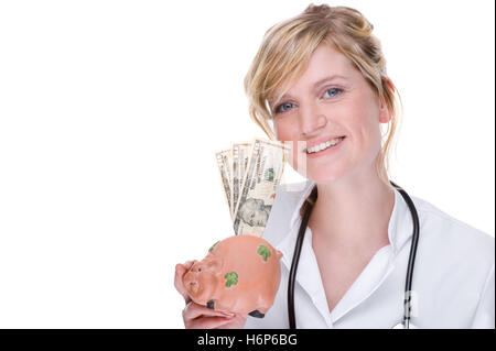 young female doctor holding piggy bank Stock Photo