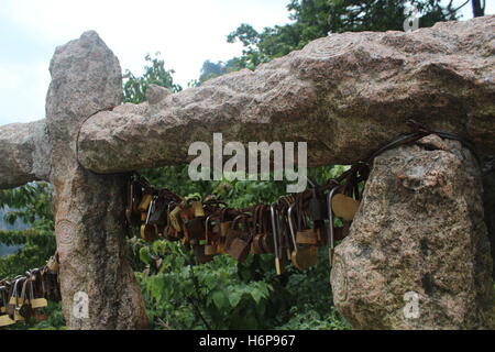 Locks on a stone bridge in Yellow mountains (Huangshan), Anhui province, China Stock Photo
