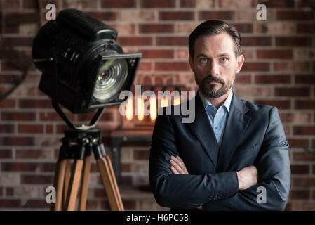 Serious confident man crossing his arms Stock Photo