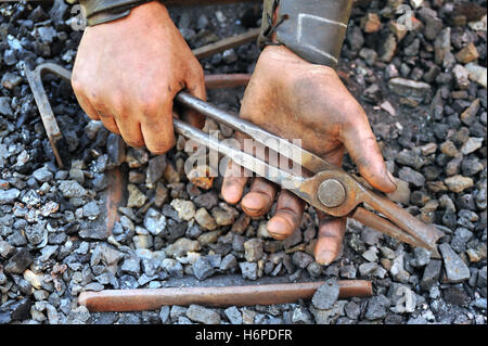 hand hands tool detail dirty smith blacksmith pliers tongs humans human beings people folk persons human human being hand hands Stock Photo