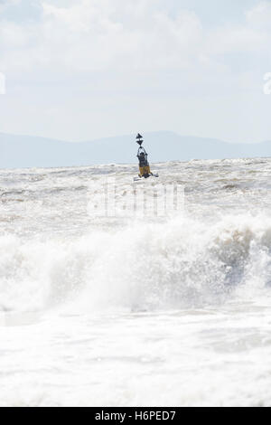 cardinal marker buoy in stormy seas Stock Photo