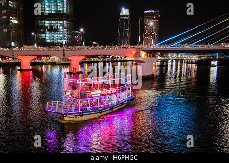 Tour boat on Han River at night. Da Nang city, Vietnam. Stock Photo
