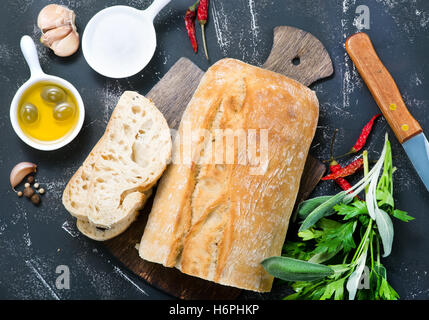 fresh bread with salt and olive oil on a table Stock Photo