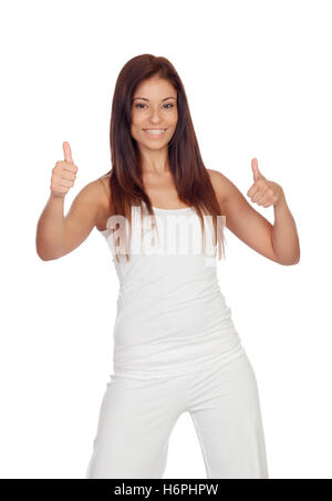 Attractive brunette girl saying Ok dressed in white isolated Stock Photo