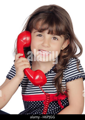 Adorable little girl wiht red phone isolated on white background Stock Photo