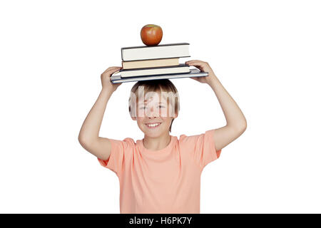 Smiling boy with books and a apple oh his head isolated on white background Stock Photo