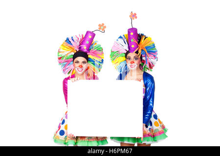 Couple of funny clowns with a blank poster isolated on white background Stock Photo