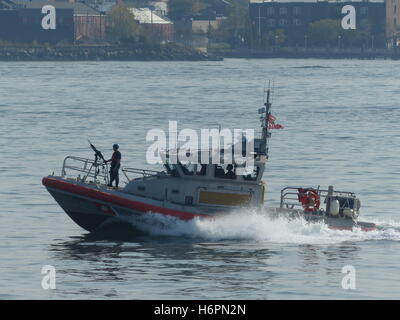 US Coast Guard patrolling New York Harbour Stock Photo