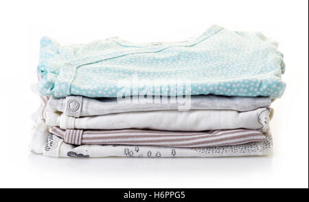 Pile of baby clothes isolated on white background Stock Photo