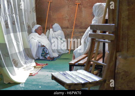 WUKRO, ETHIOPIA-MARCH 29: Orthodox christian devotees attend religious services dressed in habesha kemis and netela white clothe Stock Photo